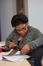 Adult Learner working on her paper