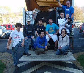 Students and faculty in a recycling truck