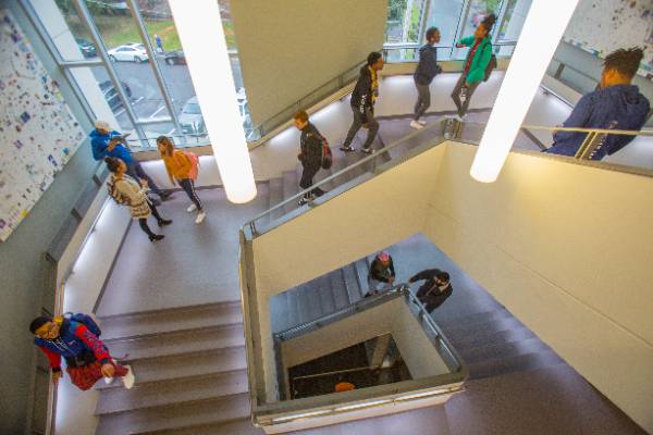 student walking up and down staircase