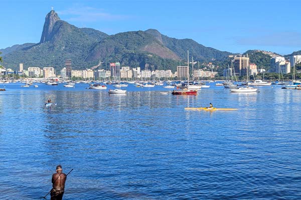 A lone fisherman in front of the Rio skyline