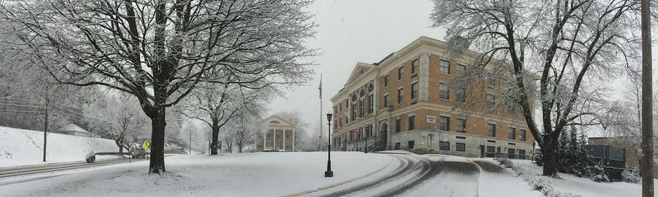 Murdock hall and driveway covered in snow