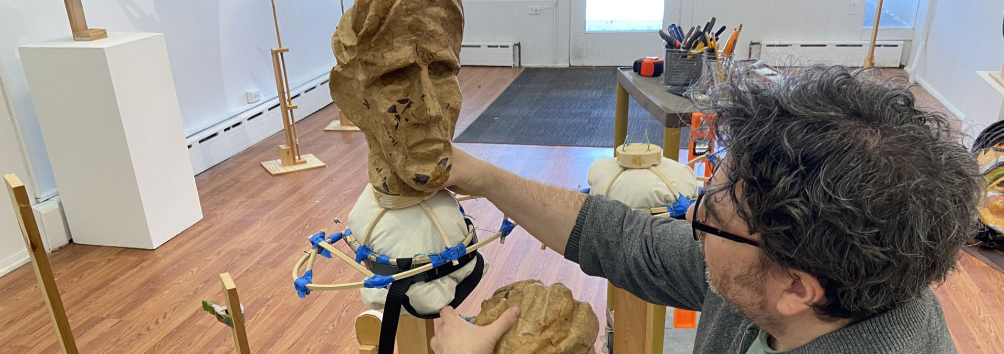 MCLA Artist in Residency artist working on a sculpture