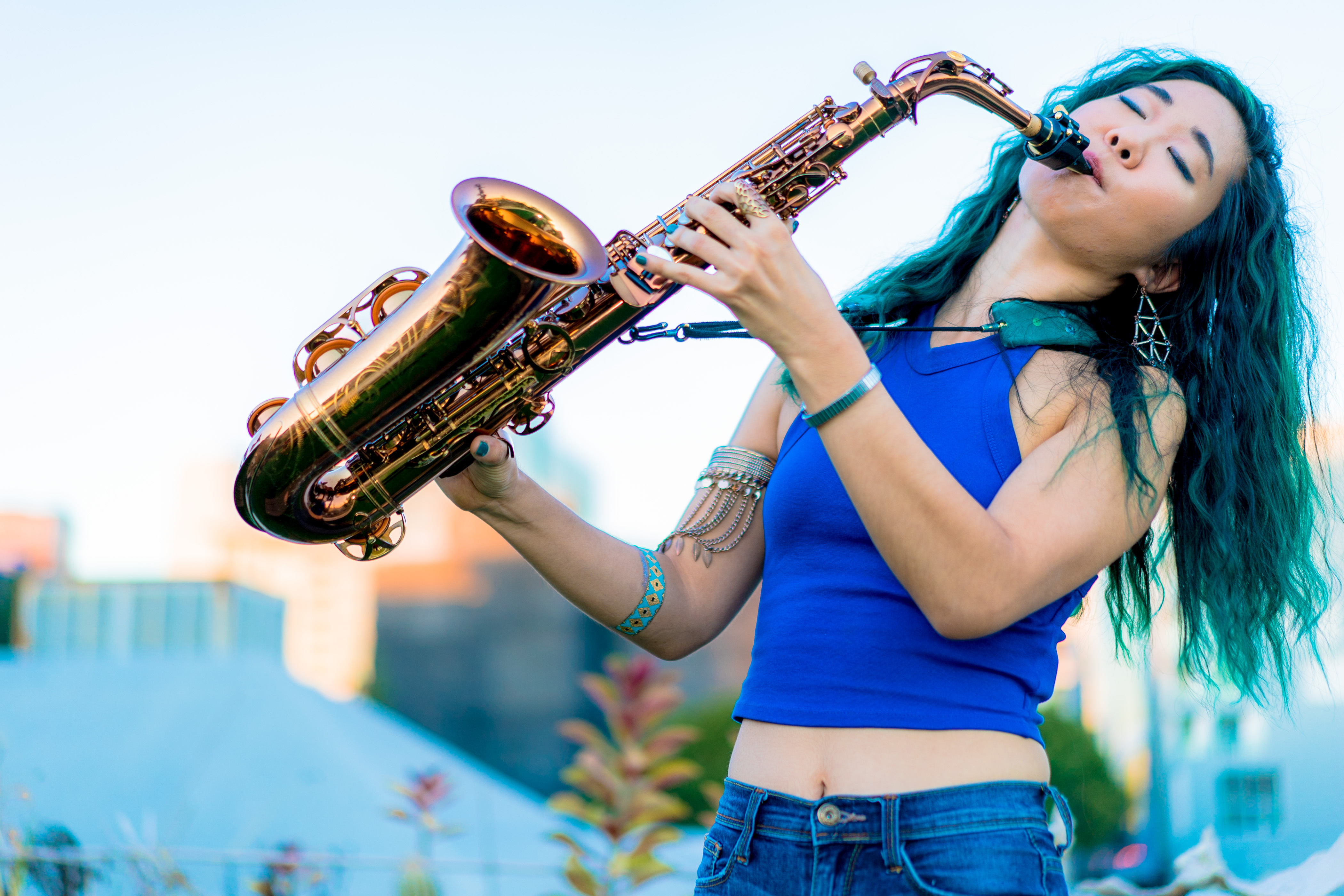Musician Grace Kelly playing the saxophone