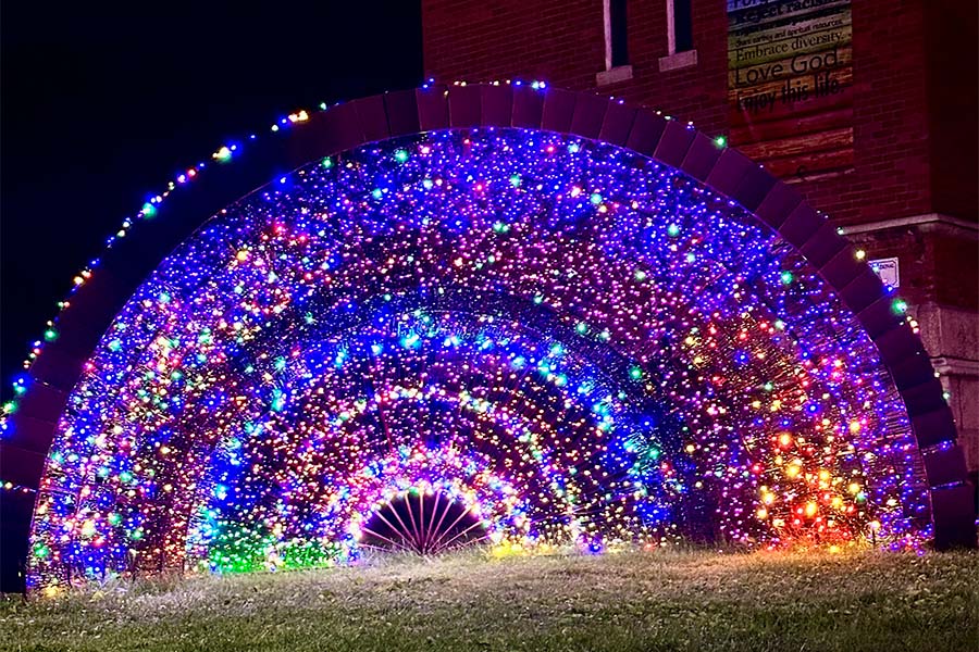 Artistic display lit up at night.