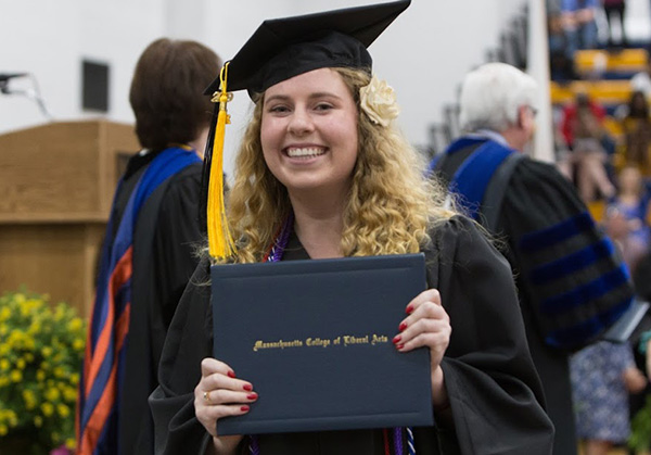 graduate with her diploma