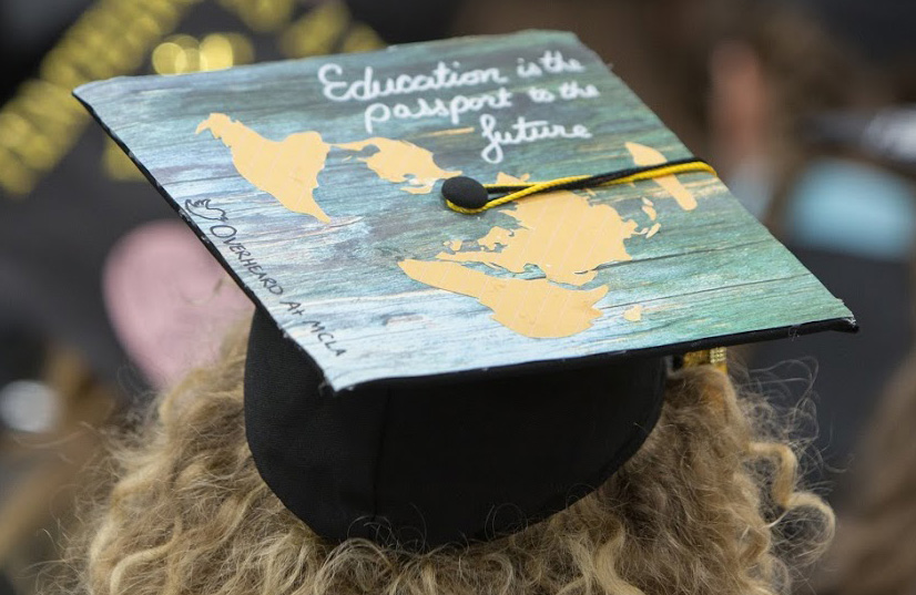 Grad's cap reading Education is the passport to the future